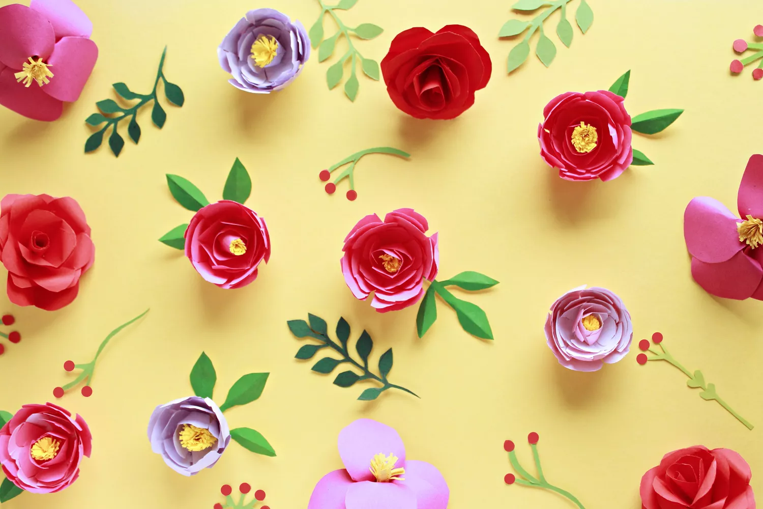 Paper flowers on the yellow background